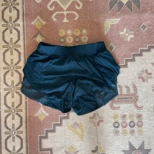 lululemon shorts with mesh/petal sides. Size 2 in teal color.